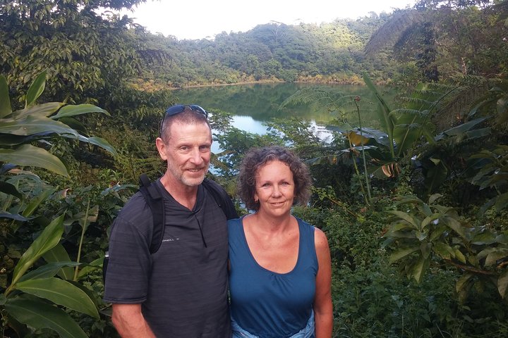 A couple looking satisfied that they have completed the hike to the top of the Lake Lanoto'o, Samoa's most famous Vocanic Crater Lake.